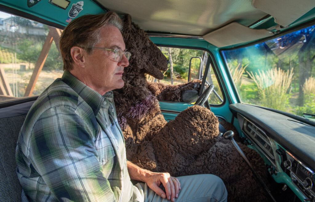 Kyle and Bear driving truck