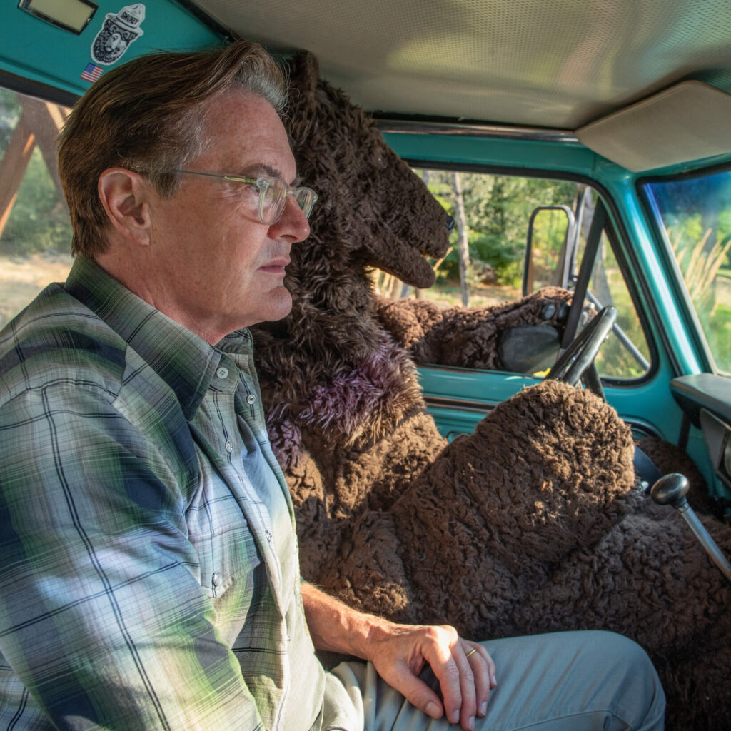 Kyle and Bear driving truck together