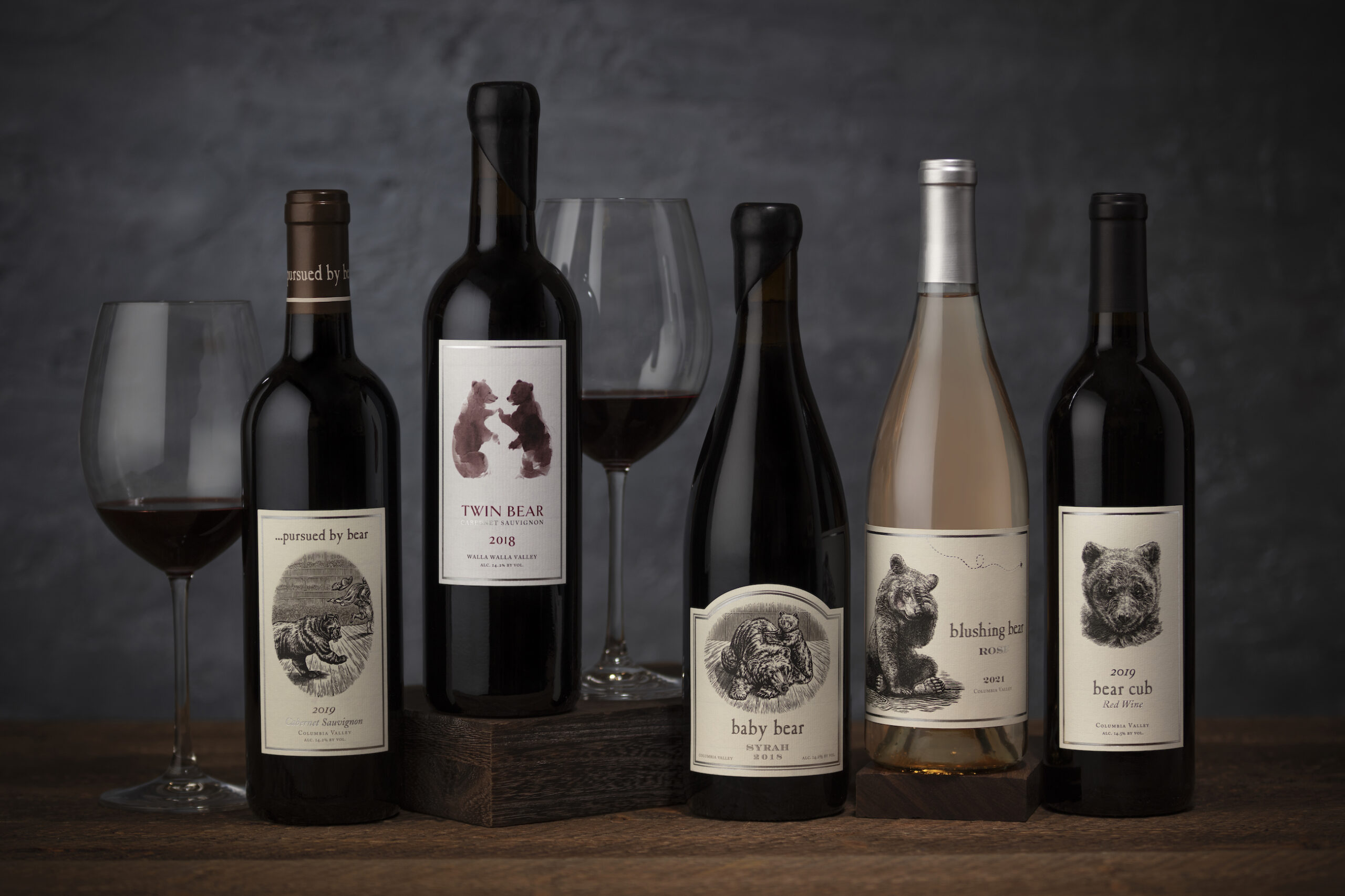 lineup of bottles and glasses